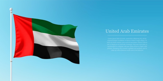 Agitar la bandera de los Emiratos Árabes Unidos contra el cielo azul claro Copyspace
