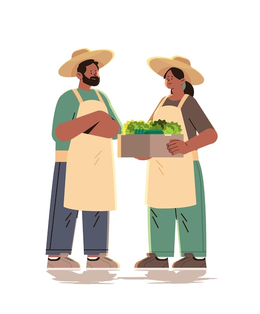Agricultores sosteniendo una canasta llena de verduras frescas concepto de celebración del día del trabajo feliz vertical