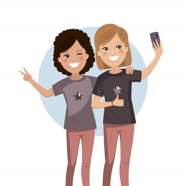 Amigos felices tomando una selfie. Las chicas son fotografiadas juntas.