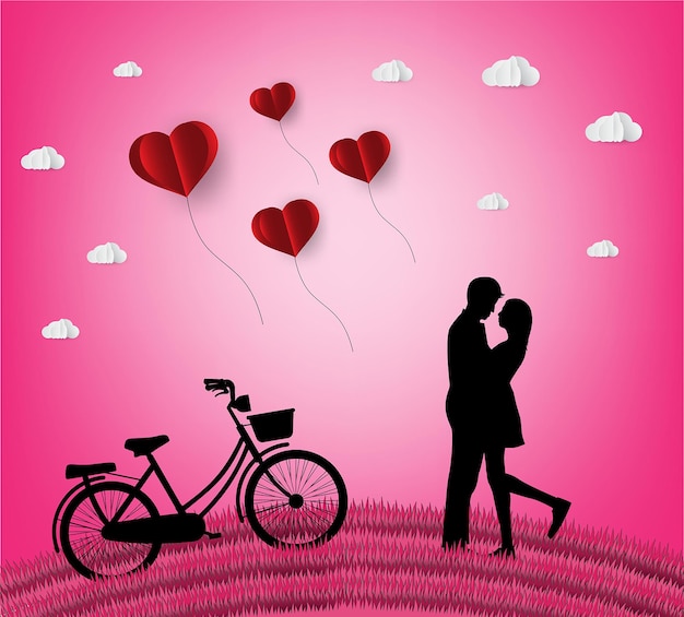 Amor y día de San Valentín Los amantes se paran en los prados y un corazón de arte de papel