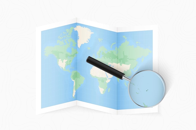 Ampliar Fiji con una lupa en un mapa del mundo plegado