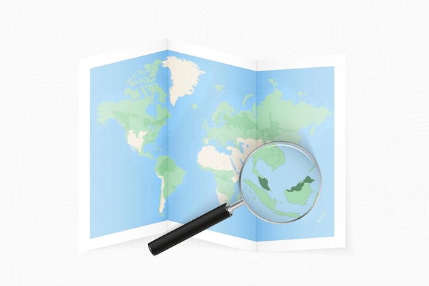 Ampliar Malasia con una lupa en un mapa plegado del mundo