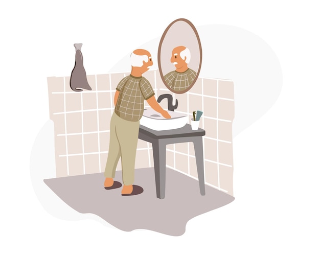 Anciano en pijama se para frente a un espejo de baño y hace su rutina matutina