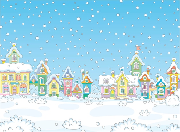 Antecedentes navideños con bonitas casas coloridas de un pequeño pueblo de juguetes en un frío y nevado día de invierno