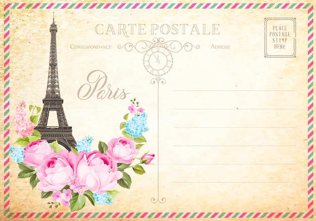 Antigua postal en blanco con sellos de correos y la torre Eiffel con flores de primavera en la parte superior.