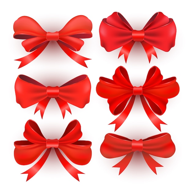 Arcos de regalo rojos con cintas.