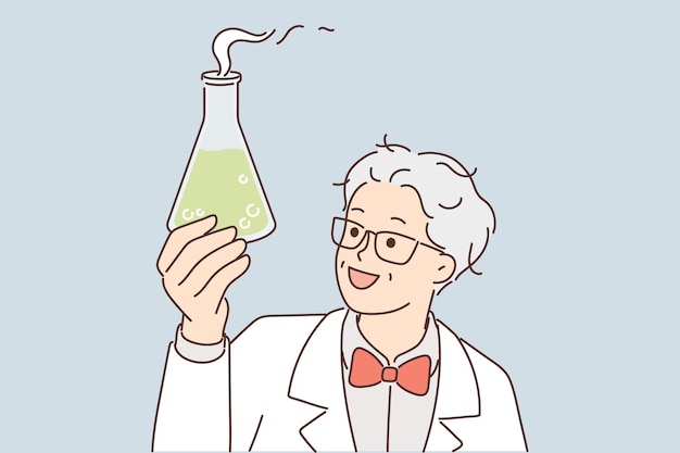 El asistente de laboratorio sostiene un matraz con líquido humeante verde mientras examina la reacción química