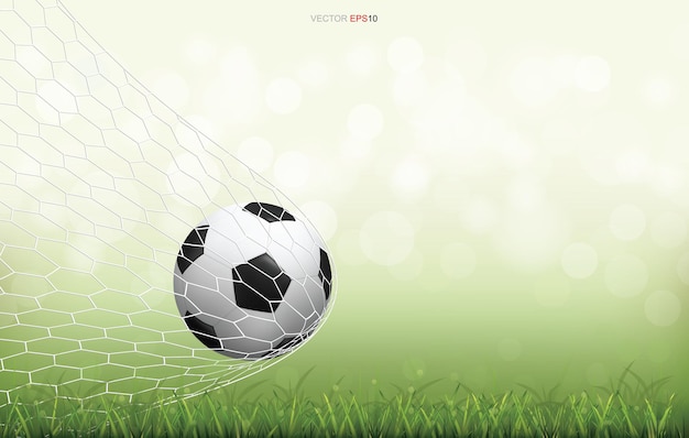 Balón de fútbol en campo de hierba verde con luz de fondo bokeh borrosa. Ilustración vectorial.