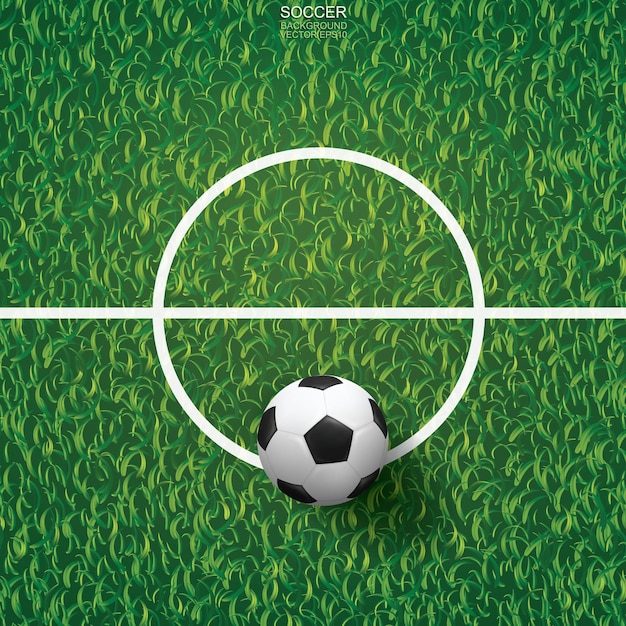 Balón de fútbol sobre la hierba verde del campo de fútbol con el área de la línea central. Ilustración vectorial.