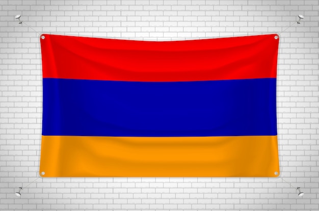 Bandera de armenia colgada en la pared de ladrillo. dibujo en 3d bandera pegada a la pared. dibujar cuidadosamente en grupos