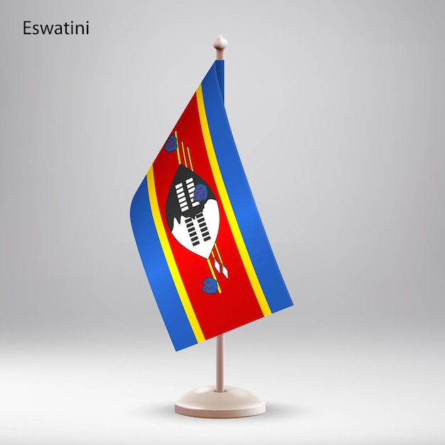 La bandera de Eswatini colgando en un soporte de bandera