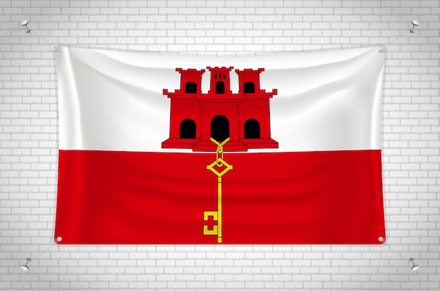 Bandera de Gibraltar colgada en la pared de ladrillo. dibujo en 3D Bandera pegada a la pared. Dibujar cuidadosamente en grupo