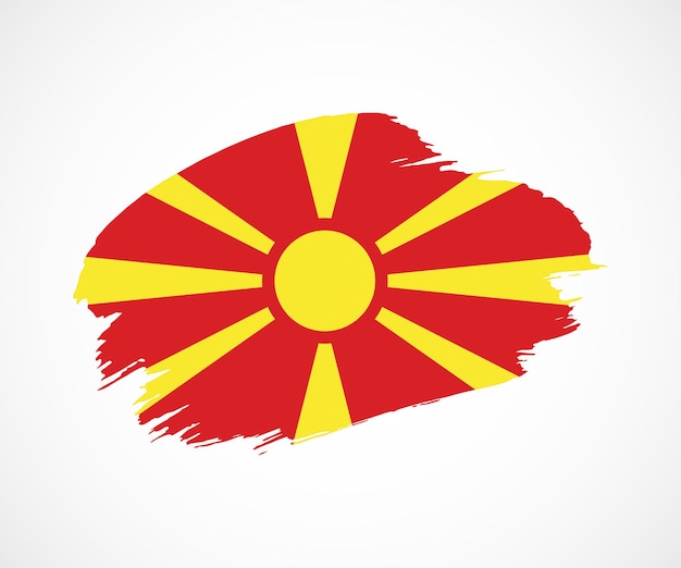 Bandera de pincel grunge pintado creativo abstracto del país de macedonia del norte con antecedentes