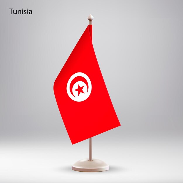 La bandera de Túnez colgando en un soporte de bandera