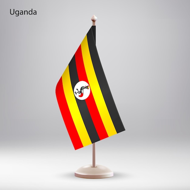La bandera de Uganda colgando en un soporte de bandera