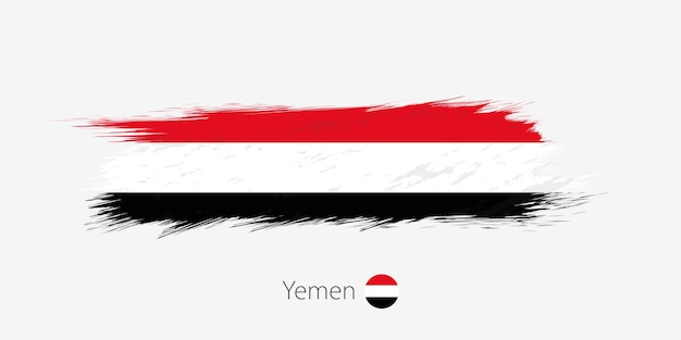 Bandera de yemen trazo de pincel abstracto grunge sobre fondo gris