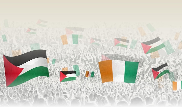 Banderas de Palestina y Costa de Marfil en una multitud de gente aplaudiendo