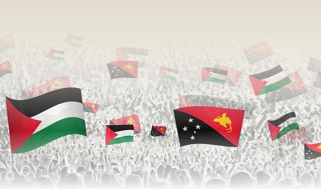 Las banderas de Palestina y Papúa Nueva Guinea en una multitud de personas que aplauden