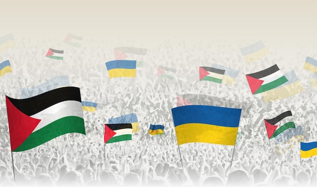 Banderas de Palestina y Ucrania en una multitud de gente aplaudiendo