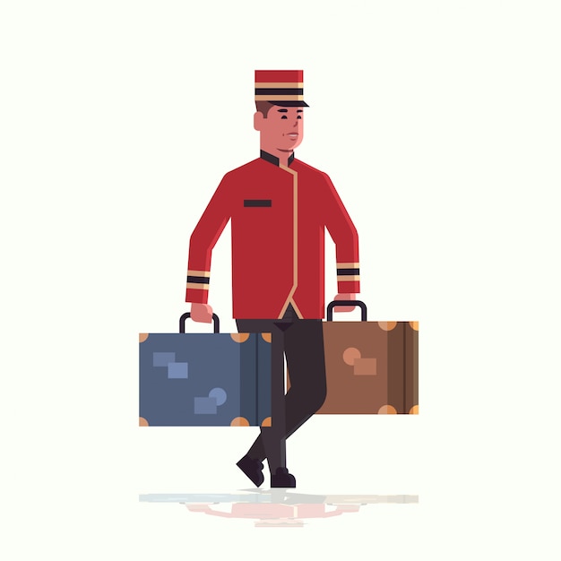 Bell boy llevando maletas concepto de servicio botones sosteniendo equipaje male hotel trabajador en uniforme