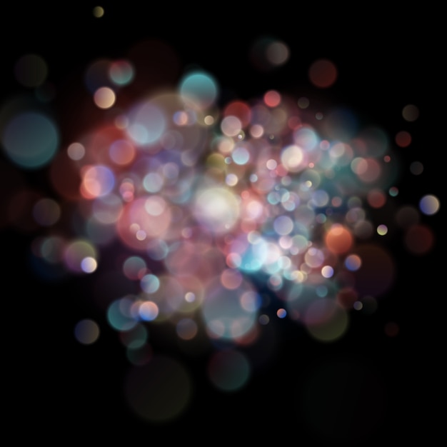 Bokeh circular desenfocado abstracto del color en fondo oscuro.