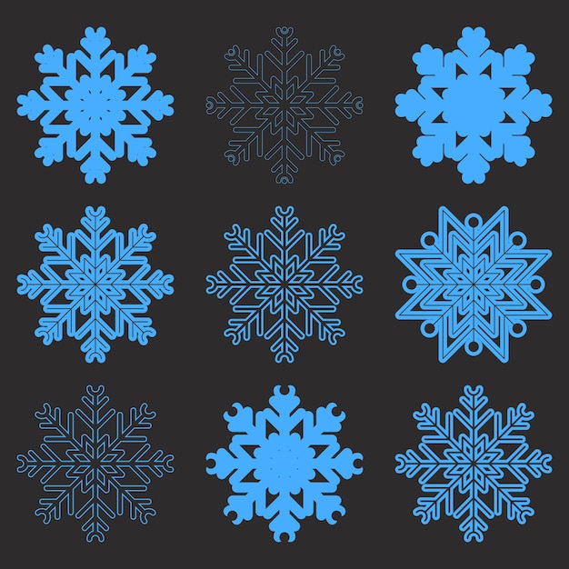Una bonita colección de copos de nieve aislados sobre un fondo azul profundo Un buen elemento para las pancartas navideñas