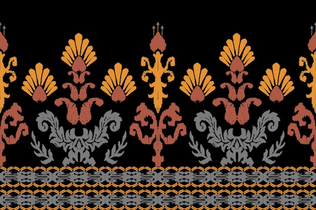 El bordado de Ikat paisley sobre fondo negro
