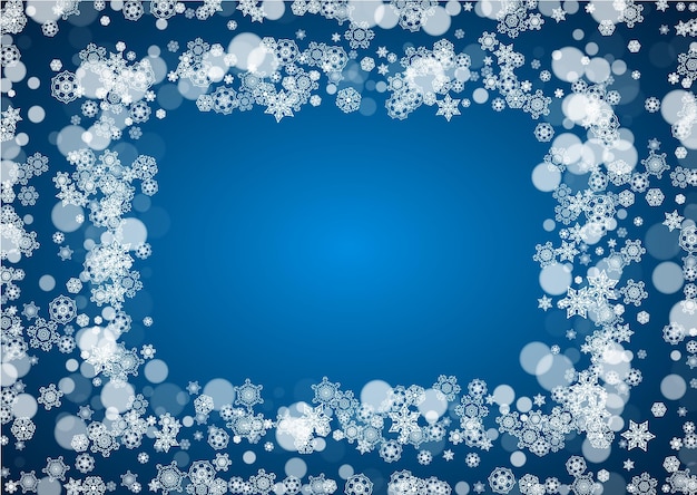 Borde de invierno con copos de nieve blancos