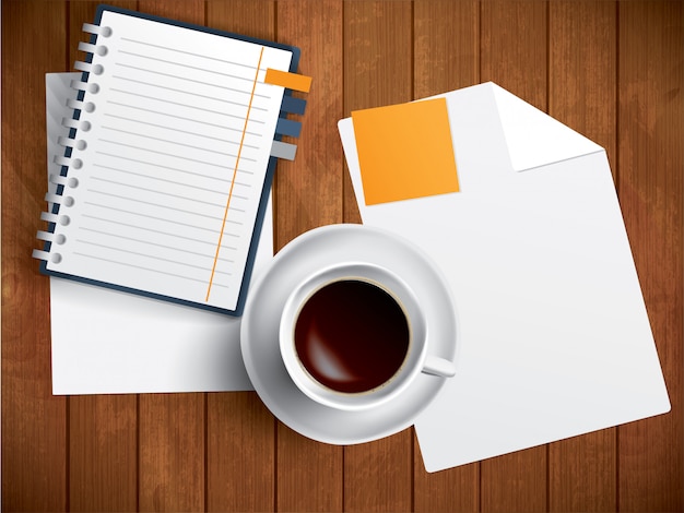 Café, cuaderno y papel sobre mesa de madera.