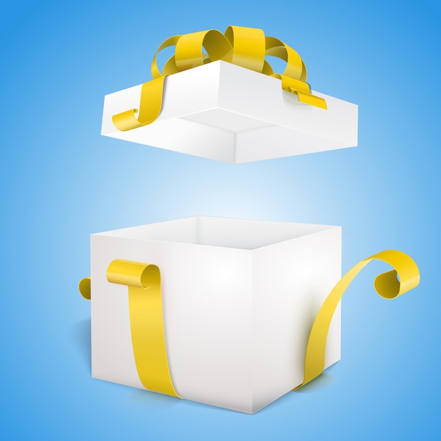 Caja de regalo abierta y con lazo amarillo y lazo.