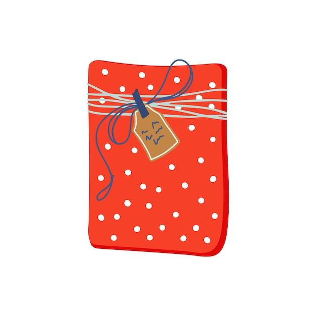 Caja de regalo empaquetada con papel adornado con lunares rojos, cuerda y etiqueta. Hermoso regalo de vacaciones.
