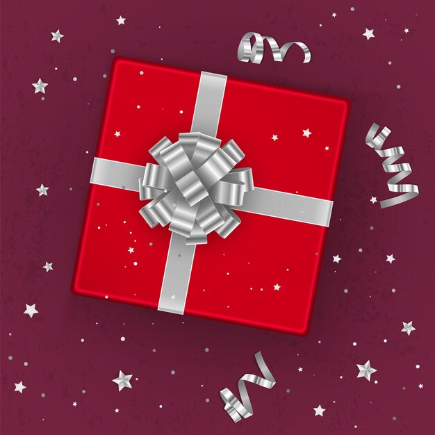 Una caja de regalo roja realista decorada con un lazo plateado, vista superior.