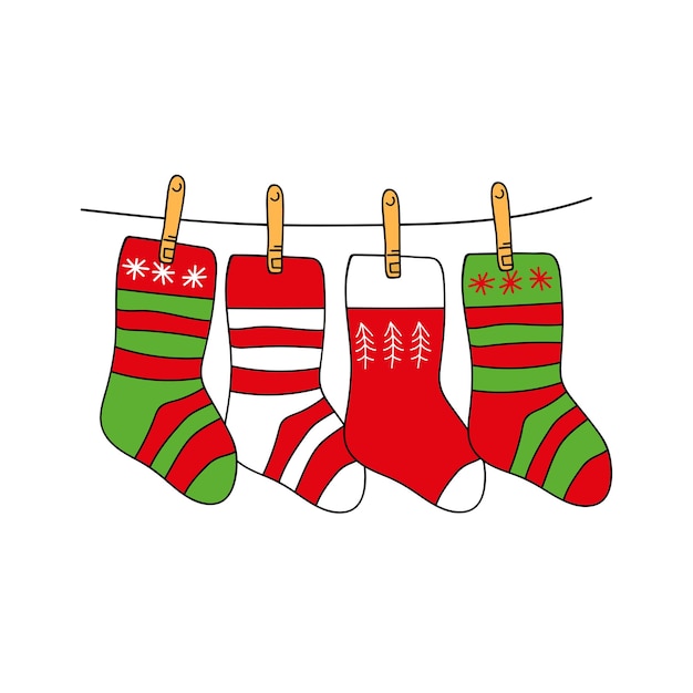Calcetines aislados en el fondo blanco Varios calcetines de Navidad colgando de una cuerda