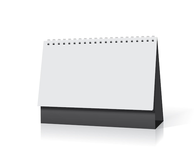 calendario de papel blanco se encuentra en la mesa