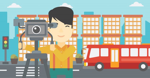 Camarógrafo con cámara de cine en trípode.
