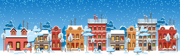 Cariñosa Navidad y casas de invierno Noche nevada en el acogedor panorama de la ciudad de Navidad