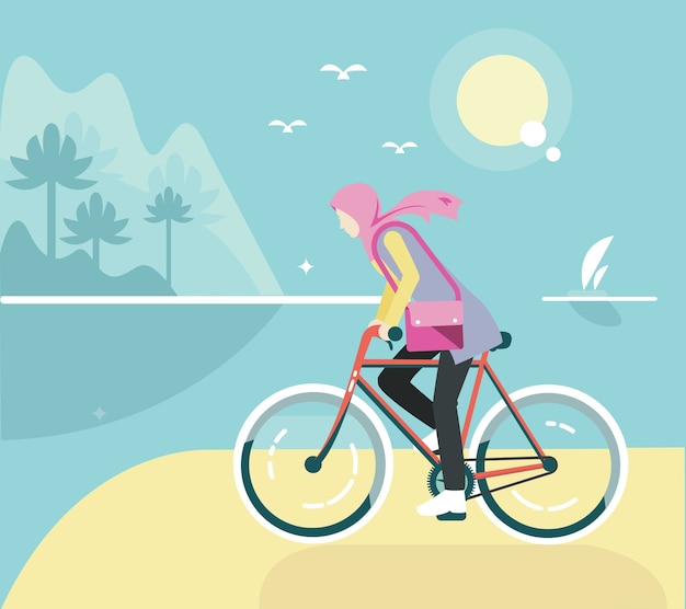 Chica de bicicleta plana con hijab en la playa