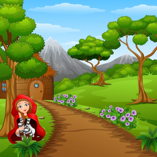 Chica con capucha roja están en el pueblo en el bosque