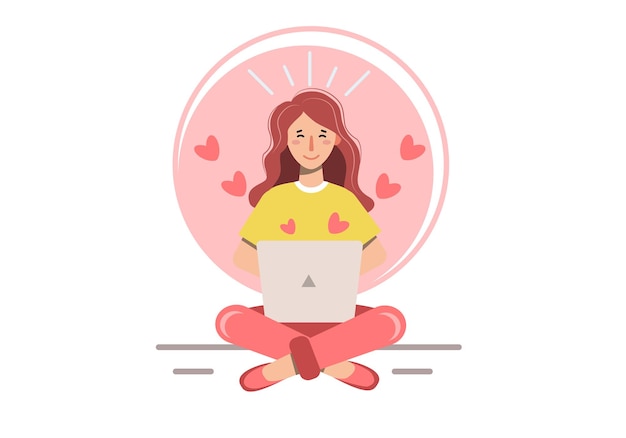 Chica enamorada se sienta con las piernas cruzadas en una pose de meditación y está mirando una computadora portátil