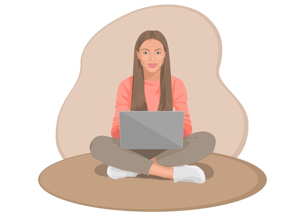 Chica independiente está sentada con las piernas cruzadas y trabajando en su computadora portátil