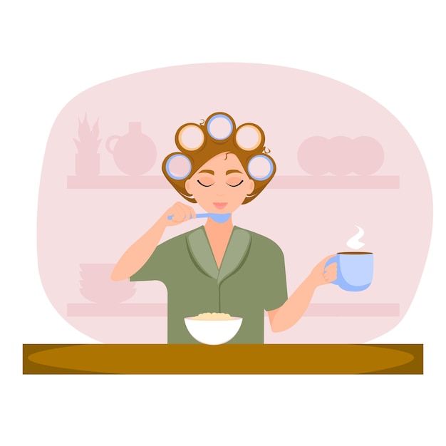Chica joven con rulos está desayunando en la cocina Concepto de rutina matutina