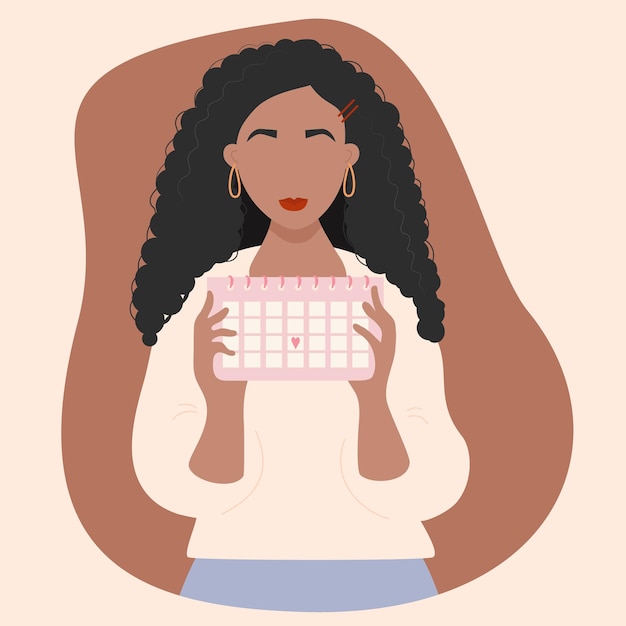 Chica mirando el calendario Chica negra étnica sosteniendo el calendario del ciclo menstrual femenino en sus manos