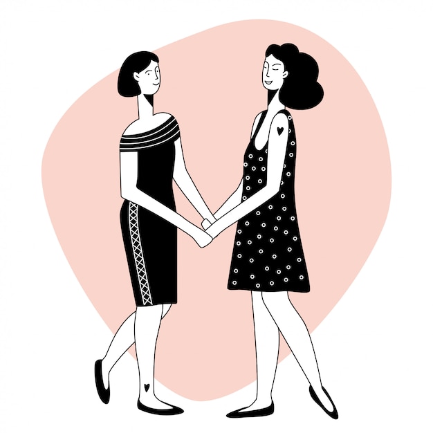 Las chicas se toman de la mano y se miran.