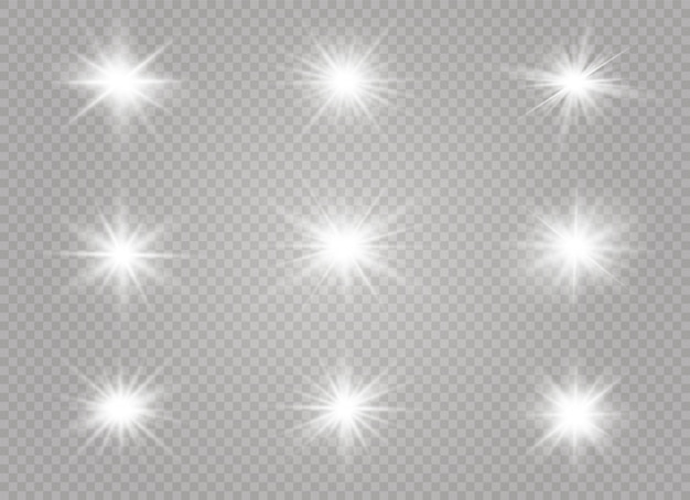 Las chispas blancas y las estrellas doradas brillan con un efecto de luz especial. destellos sobre fondo transparente.