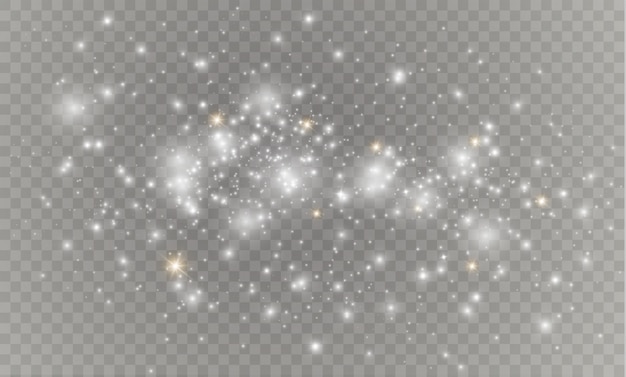 Las chispas de polvo y las estrellas doradas brillan con una luz especial. brilla sobre un fondo transparente. Efecto de luz navideña. Partículas de polvo mágico espumoso.