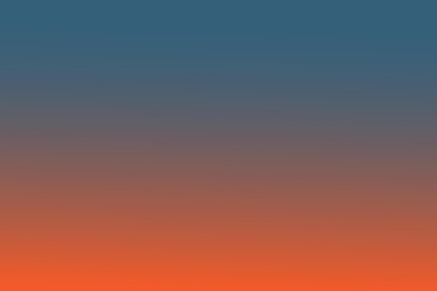 un cielo azul y naranja con unas pocas nubes en el fondo