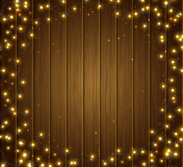 Colorido brillante guirnalda redonda de Navidad en textura de madera
