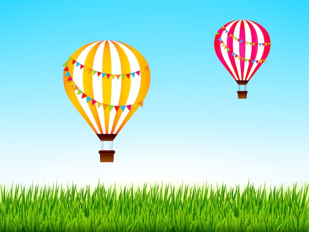 Coloridos globos aerostáticos sobre el verde paisaje. ilustración