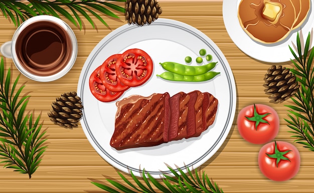 Comida de carne de cerca sobre fondo de escritorio con algunos accesorios vegetales
