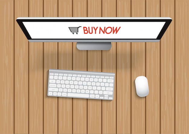 Compras con computadora y pantalla compre ahora en mesa de madera. concepto de compras online.